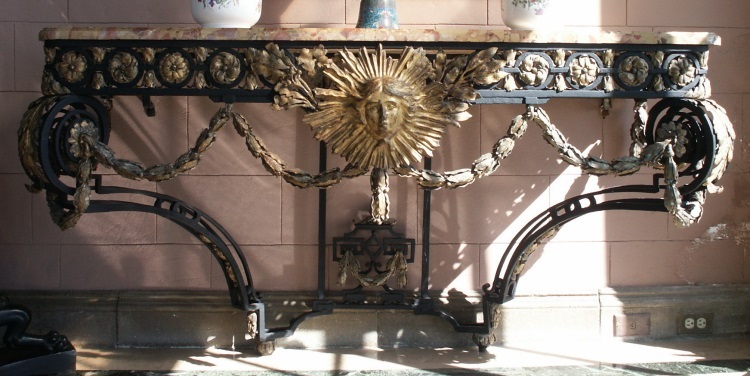 Pair of wrought iron console tables with gilding