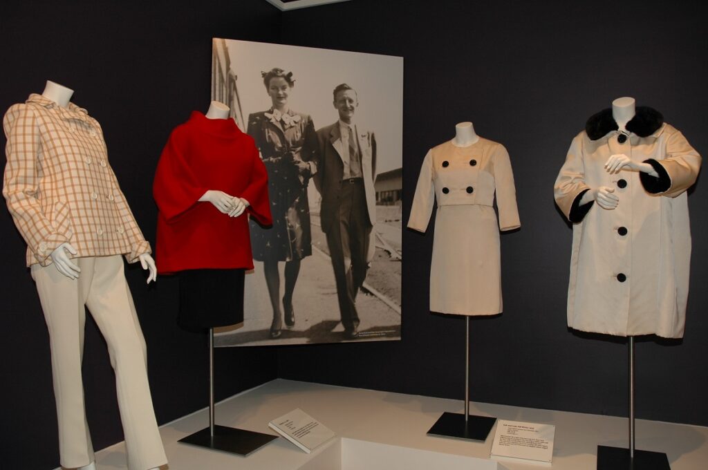 Display of various outfits and a coat