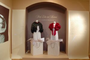 "Shop like an Heiress; buying fashion in the 20th century" display