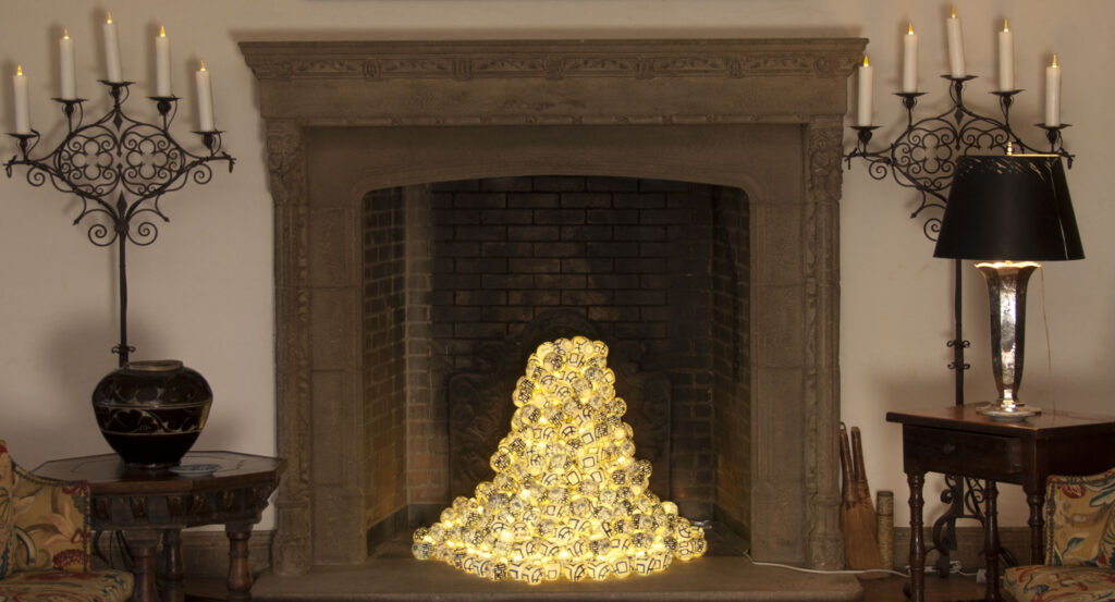 Fireplace with lighted art piece